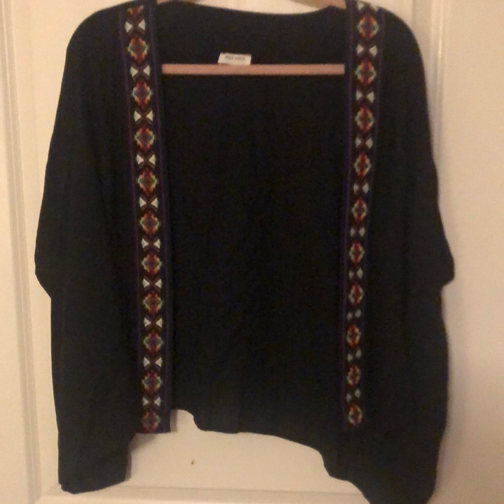 One size fits all.  Great cover up that goes with almost anything!